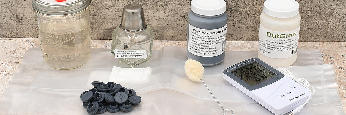 A collection of mushroom cultivation supplies including a mason jar with a syringe, growth enhancers, a temperature monitor, sterile filters, and other tools used for growing mushrooms. The image highlights the essential items available for mushroom cultivation.